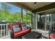 Cozy screened-in porch with comfortable seating, overlooking lush greenery, creating a peaceful retreat at 2220 Gallberry Ln, Waxhaw, NC 28173