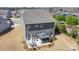 Aerial view of backyard featuring an outdoor kitchen and fireplace, and dining area, and a manicured lawn at 2248 Killian Creek Dr, Denver, NC 28037