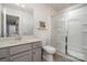Well-lit bathroom with a sleek vanity and a modern glass-enclosed shower at 2248 Killian Creek Dr, Denver, NC 28037