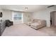 Comfortable bonus room featuring carpeted floor, lounge sofa, and an abundance of natural light at 2248 Killian Creek Dr, Denver, NC 28037
