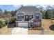 Beautiful two-story home with stone and siding exterior, a spacious driveway, and landscaped front yard at 2248 Killian Creek Dr, Denver, NC 28037