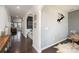 Inviting hallway with elegant archways and hardwood floors, leading to various living spaces at 2248 Killian Creek Dr, Denver, NC 28037