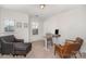 Bright home office featuring a modern desk setup and comfortable seating at 2248 Killian Creek Dr, Denver, NC 28037