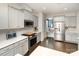 Bright kitchen with stainless steel appliances, ample counter space, and stylish gray cabinetry at 2248 Killian Creek Dr, Denver, NC 28037