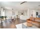 Open-concept living area with hardwood floors, a dining area, and seamless flow to the kitchen at 2248 Killian Creek Dr, Denver, NC 28037