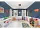 Charming playroom featuring blue accent walls and an array of colorful toys and decorations at 2248 Killian Creek Dr, Denver, NC 28037