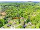 An aerial shot of the home's location at 236 Greendale Drive surrounded by mature trees at 236 Greendale Dr, Mount Holly, NC 28120