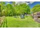 A large, well maintained backyard. It includes a trampoline and an area for relaxation at 236 Greendale Dr, Mount Holly, NC 28120