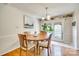 Cozy dining room featuring hardwood floors and a charming chandelier fixture at 236 Greendale Dr, Mount Holly, NC 28120