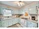 Charming kitchen with vintage-style cabinets, and a classic layout at 236 Greendale Dr, Mount Holly, NC 28120