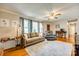 Bright living room with hardwood floors, sofa, recliner, and a ceiling fan at 236 Greendale Dr, Mount Holly, NC 28120