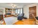 Cozy living room features a brick fireplace, hardwood floors, and comfortable seating at 236 Greendale Dr, Mount Holly, NC 28120