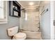 Bathroom with combined tub and shower, toilet, open shelving, and neutral wall color at 2515 Barrington Ct, Rock Hill, SC 29732