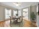 Bright dining room with wood floors, round table, and large windows at 2515 Barrington Ct, Rock Hill, SC 29732