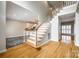Inviting foyer with hardwood floors, staircase with white railings, and natural light at 2515 Barrington Ct, Rock Hill, SC 29732