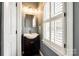 Charming half bath with a vessel sink, stylish mirror, and natural light from a window at 2515 Barrington Ct, Rock Hill, SC 29732
