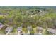 Scenic aerial shot of a neighborhood featuring a home with mature trees at 2548 Flintshire Ln, Gastonia, NC 28056