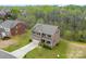 Aerial view of a well-maintained two-story home with a spacious yard and mature trees at 2548 Flintshire Ln, Gastonia, NC 28056