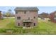 Brick home showcasing a deck with backyard views, a lawn area and brick exterior at 2548 Flintshire Ln, Gastonia, NC 28056