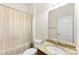 A bathroom includes a granite-topped vanity, commode, and shower with curtain at 2548 Flintshire Ln, Gastonia, NC 28056