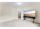 Inviting bedroom featuring neutral carpeting, fresh paint, and media setup for a modern feel at 2548 Flintshire Ln, Gastonia, NC 28056