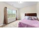 Bedroom featuring a window with backyard views and light-colored carpet at 2548 Flintshire Ln, Gastonia, NC 28056