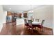 Bright dining area showcasing hardwood floors adjacent to the kitchen at 2548 Flintshire Ln, Gastonia, NC 28056