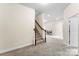 Carpeted stairs lead to another area in this hallway, providing open space at 2548 Flintshire Ln, Gastonia, NC 28056