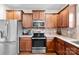 Close-up view of the kitchen with stainless steel appliances and granite countertops at 2548 Flintshire Ln, Gastonia, NC 28056