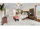 Comfortable carpeted main bedroom featuring a ceiling fan and windows with natural light at 2548 Flintshire Ln, Gastonia, NC 28056