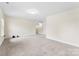 This spacious, carpeted room has a window and an open view to the second level at 2548 Flintshire Ln, Gastonia, NC 28056