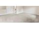 This carpeted space features a white door and an open doorway with an oval mirror at 2548 Flintshire Ln, Gastonia, NC 28056
