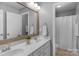 The main bathroom features a double sink vanity, large mirror, and full shower and bath at 3013 Kensley Dr, Waxhaw, NC 28173