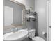 Bathroom with modern fixtures, open shelves, and a stylish mirror at 3013 Kensley Dr, Waxhaw, NC 28173