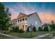 Desirable neighborhood home features a manicured lawn and inviting porch, set on a corner lot at 3013 Kensley Dr, Waxhaw, NC 28173
