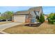 Exterior view of a two-story home with a two car garage and a well maintained lawn at 3013 Kensley Dr, Waxhaw, NC 28173