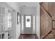 Bright hallway featuring wood door and shiplap walls at 3013 Kensley Dr, Waxhaw, NC 28173