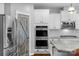 Modern kitchen with double ovens, subway tile, and granite countertops at 3013 Kensley Dr, Waxhaw, NC 28173