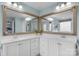 Main bathroom showcases dual vanities, a wide mirror, and a view into the water closet at 3013 Kensley Dr, Waxhaw, NC 28173