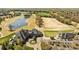 Aerial view of estate, golf course, lake, and beautifully landscaped grounds at 318 Montrose Dr, Waxhaw, NC 28173