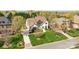 Aerial view of a two-story home with a large front yard and mature trees at 318 Montrose Dr, Waxhaw, NC 28173