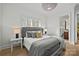 Beautiful bedroom with hardwood floors, crown molding, and decorative overhead lighting fixture at 318 Montrose Dr, Waxhaw, NC 28173