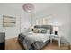 Beautiful bedroom with hardwood floors, crown molding, and decorative overhead lighting fixture at 318 Montrose Dr, Waxhaw, NC 28173