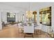 Bright dining area with large windows, modern chandelier, and open floor plan at 318 Montrose Dr, Waxhaw, NC 28173