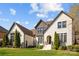 Beautiful exterior elevation showcases the manicured lawn and modern design of this two-story home at 318 Montrose Dr, Waxhaw, NC 28173