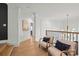 Bright hallway with elegant curved walls, hardwood floors, and modern lighting, creating an inviting space at 318 Montrose Dr, Waxhaw, NC 28173