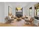Cozy sitting room with fireplace, modern lighting, and comfortable chairs at 318 Montrose Dr, Waxhaw, NC 28173