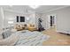 Inviting living room with a projector, exercise equipment, and a comfortable seating arrangement at 318 Montrose Dr, Waxhaw, NC 28173