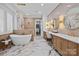 Luxurious bathroom with soaking tub, marble floors, and dual vanities at 318 Montrose Dr, Waxhaw, NC 28173