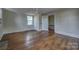 Bedroom featuring hardwood floors, ceiling fan, and two closets at 35 E Catawba St, Belmont, NC 28012